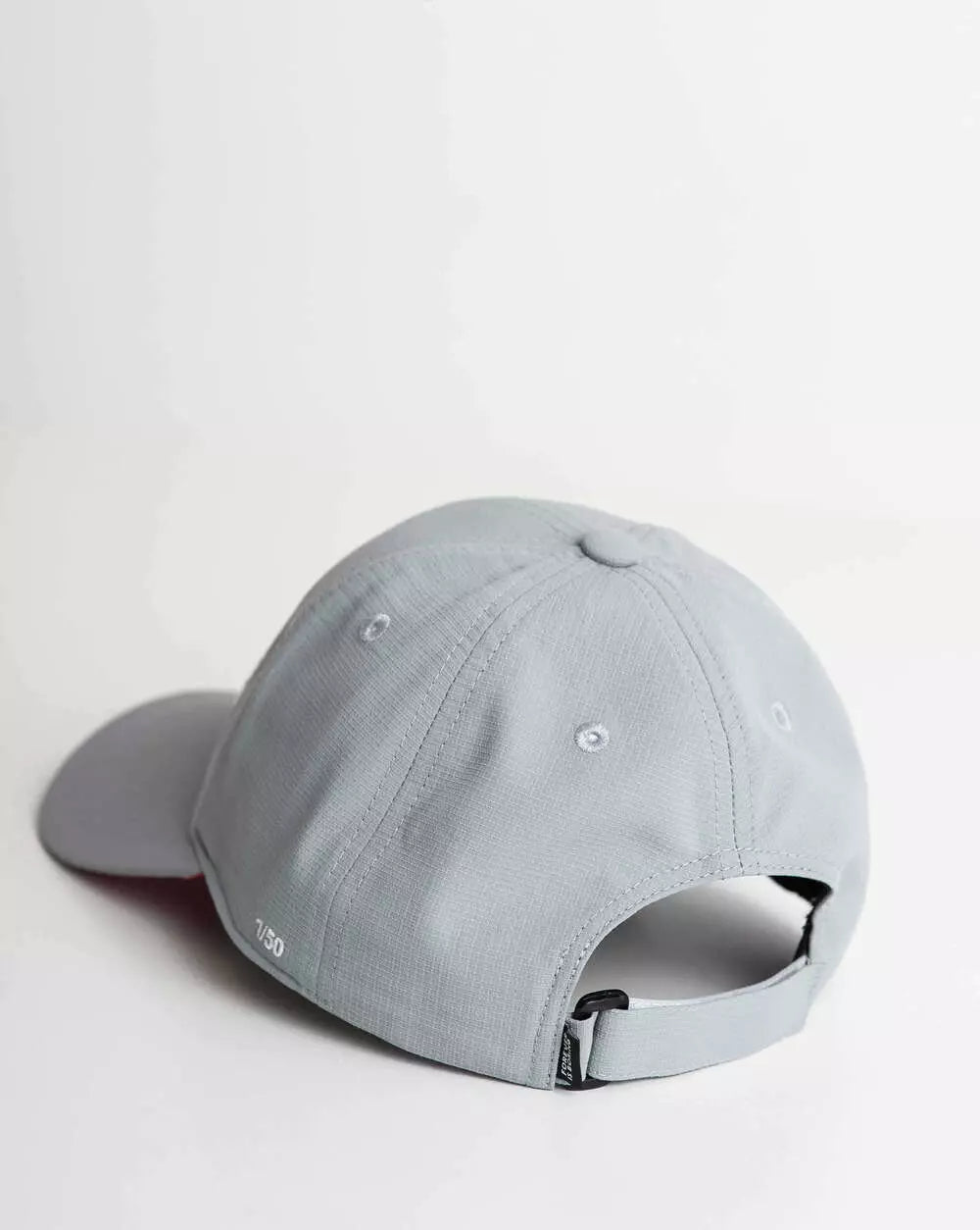 Cap FIB Grey Grid embroidery with the edition number on the side in white.