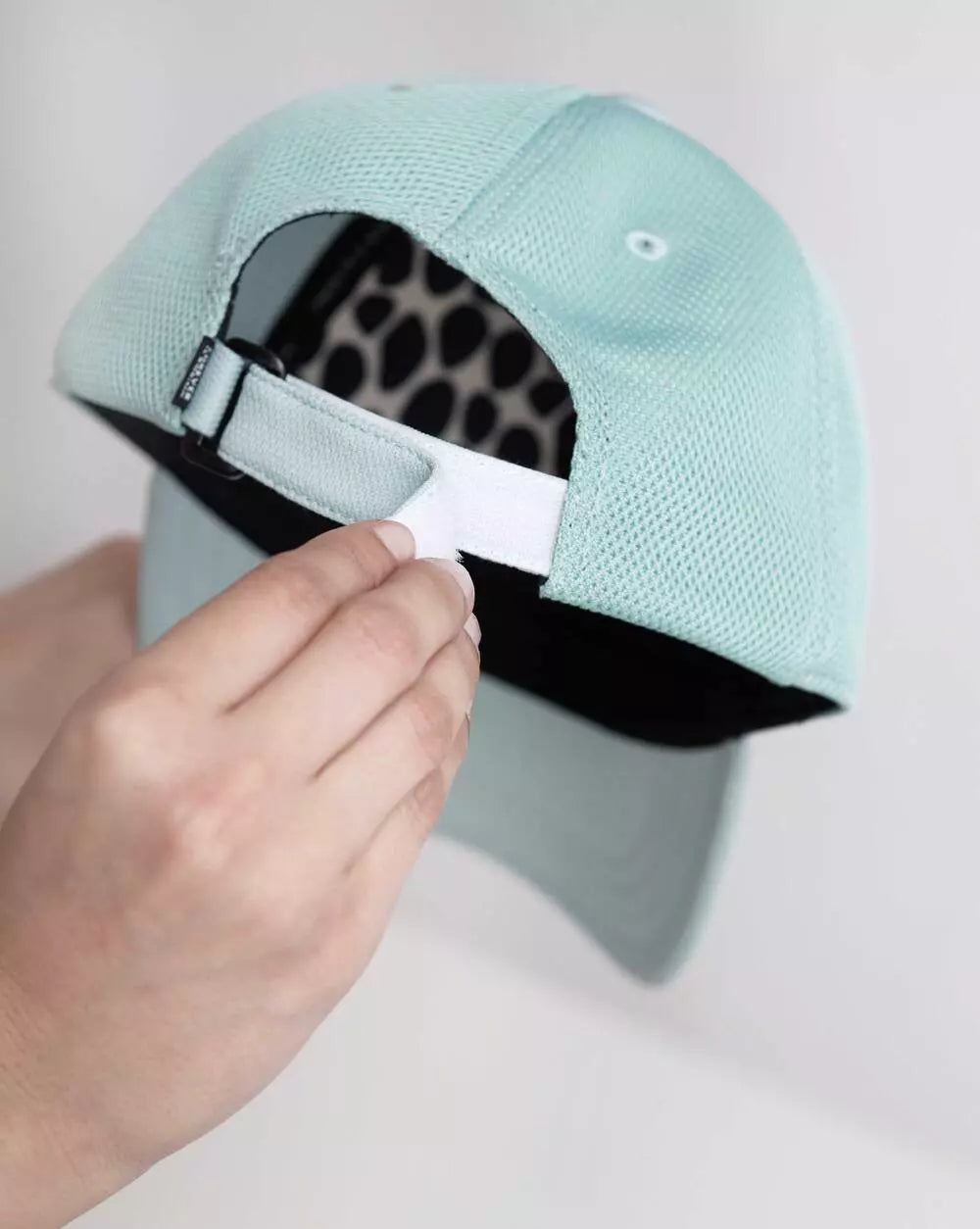 FIB Mint Mesh Cap with adjustable strap in the back.